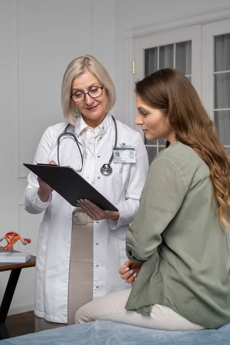 Healthcare professional speaking gently with a patient